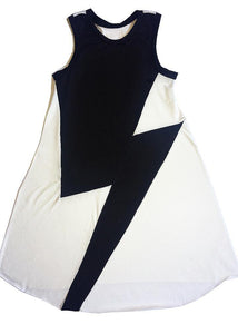 Long white Peruvian cotton dress with a big black thunderbolt on the front. To use without stopping,  light, soft and easy. We avoided side seams for more comfort and a beautiful feeling.  It also adapts very well to size changes due to it´s shape and design... it lasts forever. 2 to 9 years of age.