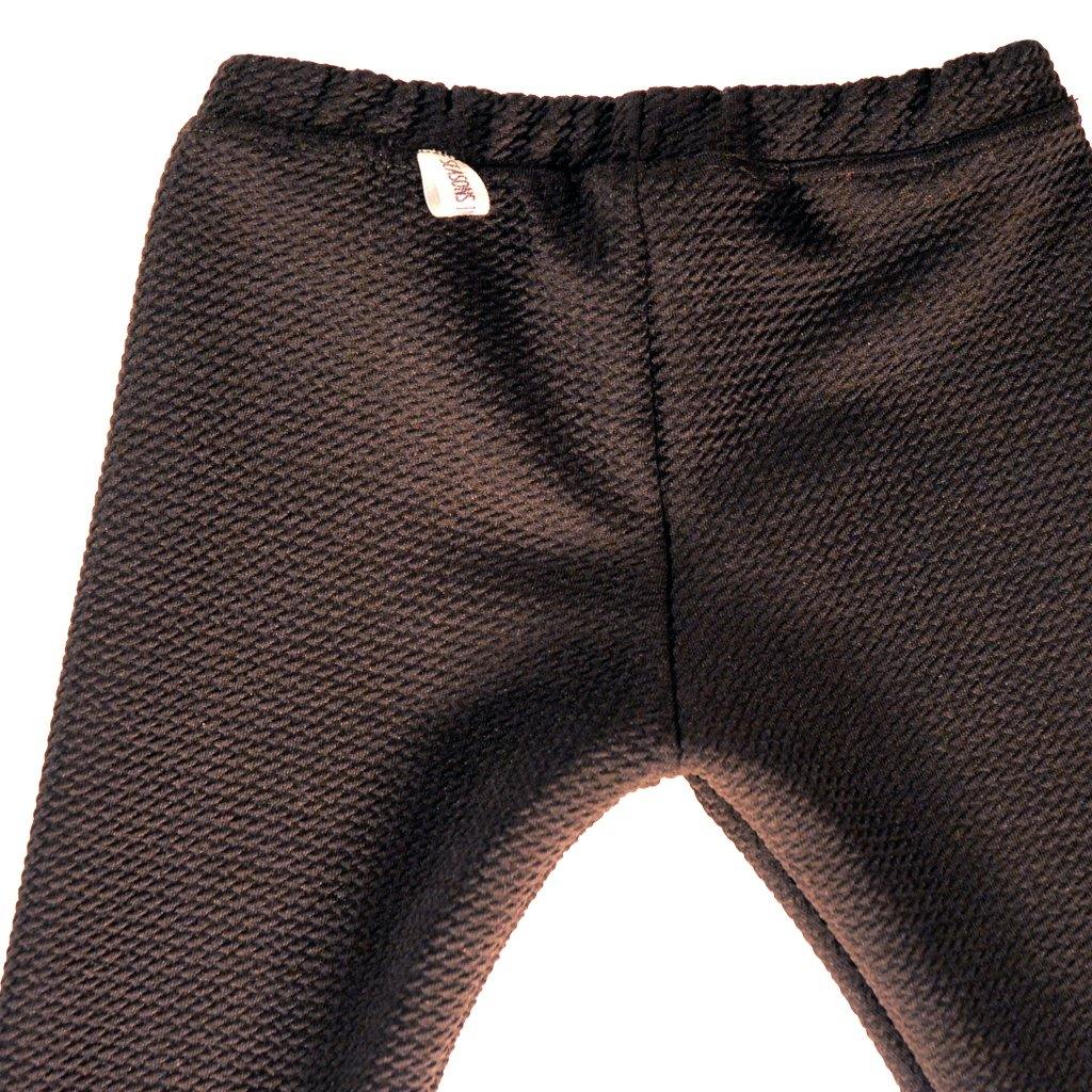 Black stretch pants with a very cool texture. Legging style,  goes well with different looks, and are unisex. Try them with a cotton t-shirt and a cool coat for both boys and girls, or under a dress or a tutu for a big party. Unisex.