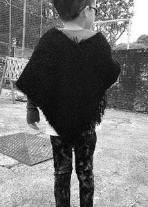 100% handmade black poncho for kids, super soft, light and cool.  SO easy to wear, perfect for them who no longer want help: they are happy with the autonomy that it gives them when dressing and undressing. Unisex. Each piece is unique; being a handmade product it's shapes can vary minimally. 