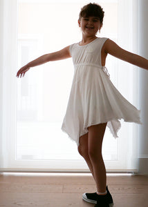 Light-as-air white 100% cotton dress, soft and fresh to dream about. Raw edges and a reflective crown on the front. Very wide armholes and back, unbeatable for a beach look or a summer party. We are just in love with white.  